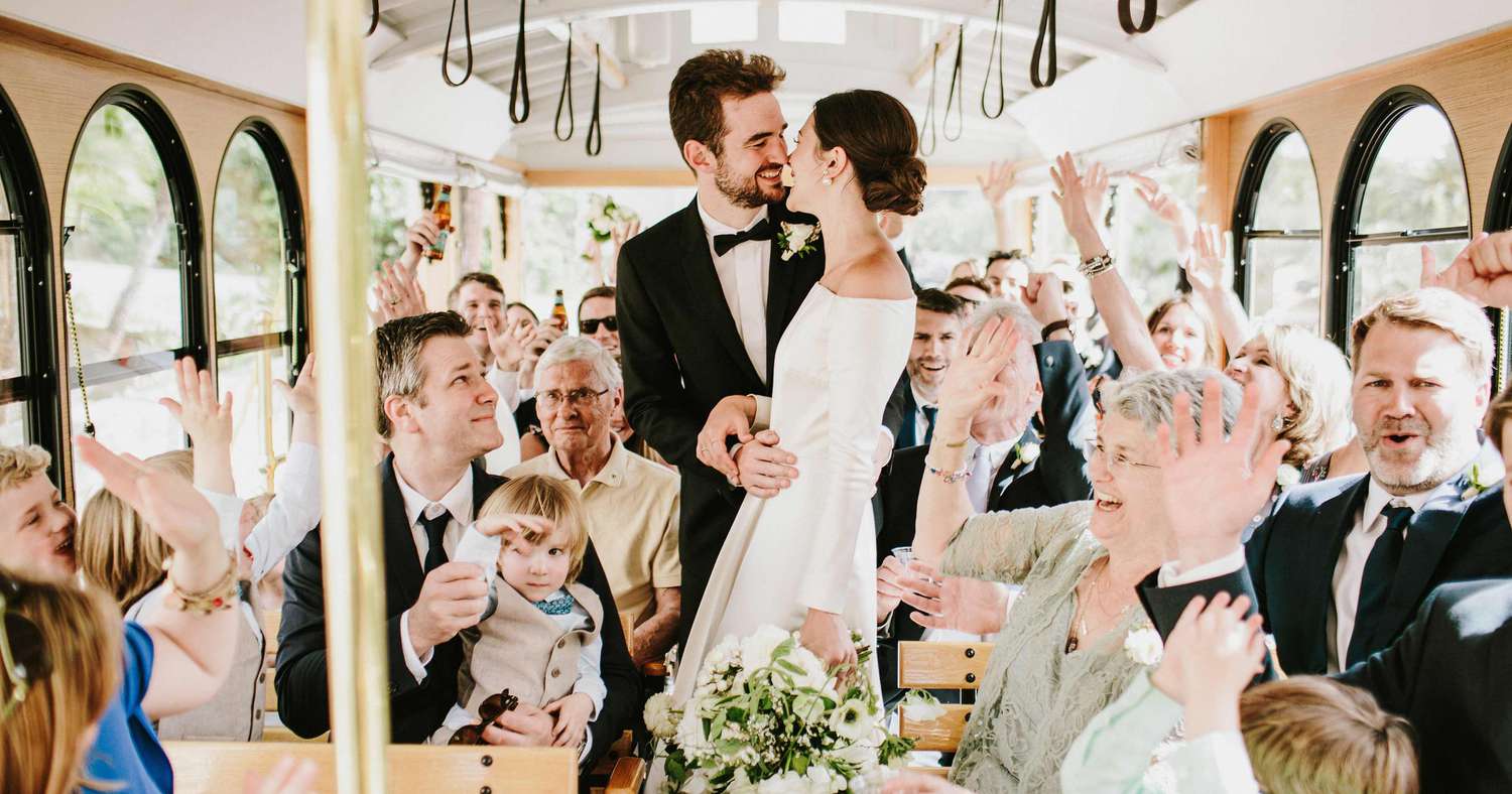 Wedding party boarding a Mercedes Sprinter shuttle for guest transportation in Houston.