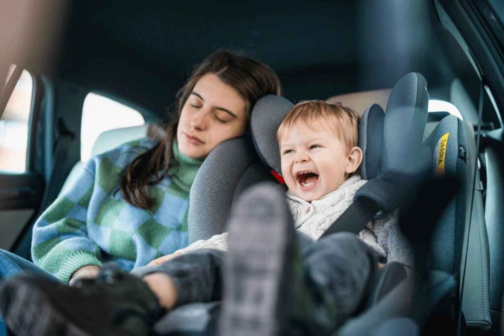 Children safely seated in car seats during a Houston car service with car seats for secure family travel