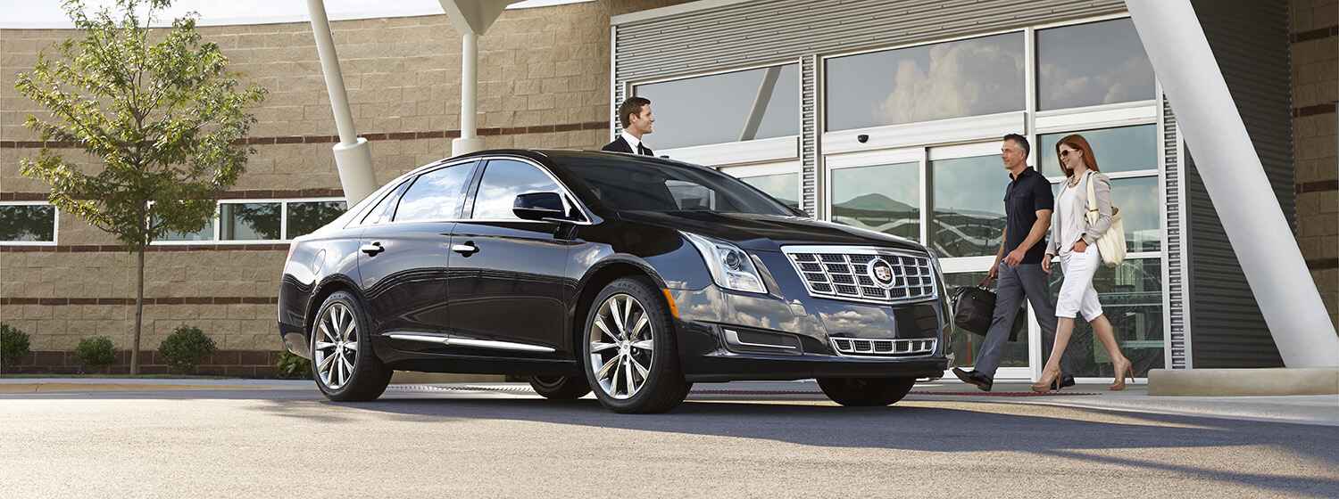 Elite chauffeur providing private transportation Houston with luxury sedan service at hotel pickup