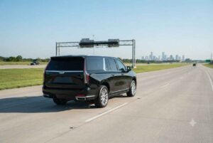 Black executive SUV at IAH airport terminal departures curbside from Katy car service